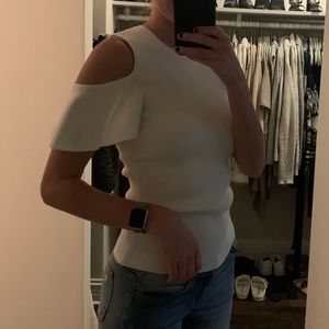 White, ripped sweater with shoulder cut outs